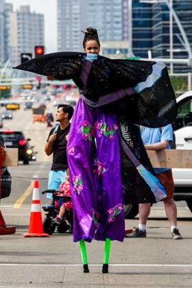 August 8, 2026, Edmonton, Alberta, Canada: A female Mas Bands stilt walker dances through downtown Edmonton during the Cariwest Parade on day 2 of the Cariwest Festival..Western Canada s largest Caribbean Festival, Cariwest, held its annual parade as part of its 42nd year of festivities. The Parade Mas Bands represent the various Caribbean various Islands and are dressed in brightly colored costumes, some of which can weigh up to 200 lbs, requiring wheels to support the weight. Edmonton Canada - ZUMAs197 20260808_aaa_s197_230 Copyright: xRonxPalmerx
