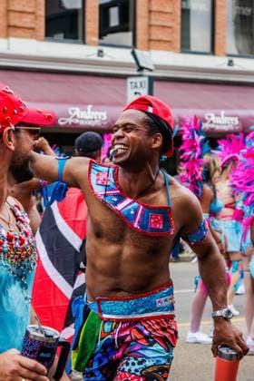 August 8, 2026, Edmonton, Alberta, Canada: A member of Mas Band Aurora danced through downtown Edmonton during the Cariwest Parade on day 2 of Cariwest Festival..Western Canada s largest Caribbean Festival, Cariwest, held its annual parade as part of its 42nd year of festivities. The Parade Mas Bands represent the various Caribbean various Islands and are dressed in brightly colored costumes, some of which can weigh up to 200 lbs, requiring wheels to support the weight. Edmonton Canada - ZUMAs197 20260808_aaa_s197_232 Copyright: xRonxPalmerx