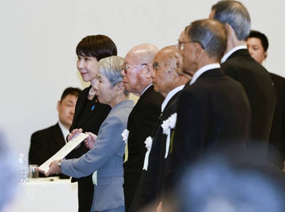 81st A-bomb anniversary in Nagasaki Japanese Prime Minister Sanae Takaichi (back) receives paper listing a set of demands during a meeting with representatives of groups of atomic bomb survivors in Nagasaki on Aug. 9, 2026, after attending a memorial ceremony marking the 81st anniversary of the U.S. atomic bombing of the southwestern Japan city in World War II.  A14AA0005625409P