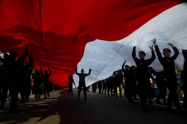 August 9, 2026, Bogor, West Java, Indonesia: Indonesian Mobile Brigade Corps take part in carrying a 500-metre-long national flag as they marched through the streets of Bogor, West Java, during the ˜Merah Putih™ Festival parade ahead of Indonesia™s 81st Independence Day celebrations. Bogor Indonesia - ZUMAa216 20260809_zip_a216_003 Copyright: xAdrianaxAdiex