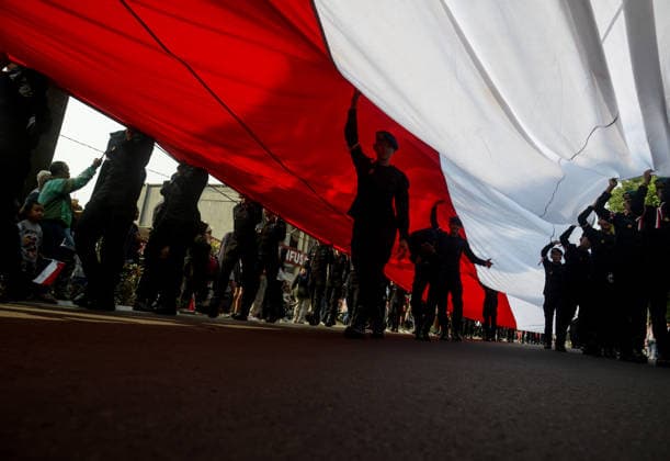 August 9, 2026, Bogor, West Java, Indonesia: Indonesian Mobile Brigade Corps take part in carrying a 500-metre-long national flag as they marched through the streets of Bogor, West Java, during the ˜Merah Putih™ Festival parade ahead of Indonesia™s 81st Independence Day celebrations. Bogor Indonesia - ZUMAa216 20260809_zip_a216_006 Copyright: xAdrianaxAdiex