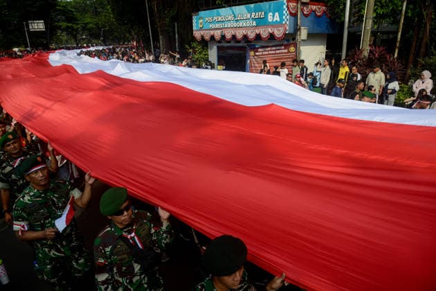 August 9, 2026, Bogor, West Java, Indonesia: Soldiers take part in carrying a 500-metre-long national flag as they marched through the streets of Bogor, West Java, during the ˜Merah Putih™ Festival parade ahead of Indonesia™s 81st Independence Day celebrations. Bogor Indonesia - ZUMAa216 20260809_zip_a216_010 Copyright: xAdrianaxAdiex