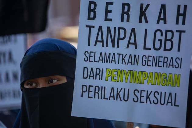 August 9, 2026, Surabaya, Indonesia: SURABAYA, Indonesia Ã¢â‚¬ August 9, 2026: Thousands of demonstrators affiliated with the Alliance of Communities Concerned for the Generation gather on Governor Suryo Street during a rally opposing LGBTQ rights. Participants carried flags and banners expressing opposition to lesbian, gay, bisexual, transgender, and queer (LGBTQ) people and related issues. Surabaya Indonesia - ZUMAq101 20260809_zna_q101_003 Copyright: xMuhammadxIffanxMaulanax
