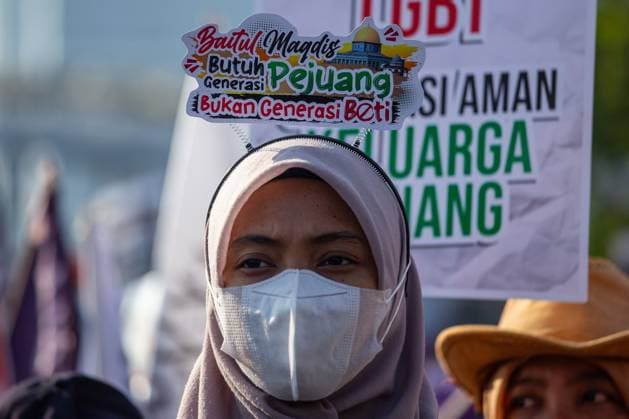 August 9, 2026, Surabaya, Indonesia: SURABAYA, Indonesia Ã¢â‚¬ August 9, 2026: Thousands of demonstrators affiliated with the Alliance of Communities Concerned for the Generation gather on Governor Suryo Street during a rally opposing LGBTQ rights. Participants carried flags and banners expressing opposition to lesbian, gay, bisexual, transgender, and queer (LGBTQ) people and related issues. Surabaya Indonesia - ZUMAq101 20260809_zna_q101_006 Copyright: xMuhammadxIffanxMaulanax