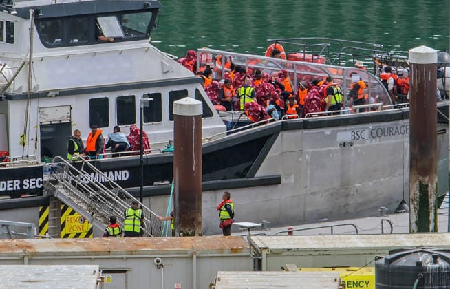 Rescued migrants escorted by BSC Courageous in UK DOVER, UNITED KINGDOM - AUGUST 9: Border Security Command vessel Courageous escort migrants into Dover Docks, Kent, United Kingdom on August 9, 2026. The migrants were rescued in the middle of the channel trying to reach the UK. Stuart Brock Anadolu Dover United Kingdom. Editorial use only. Please get in touch for any other usage.  Copyright: x2026xAnadoluxStuartxBrockx