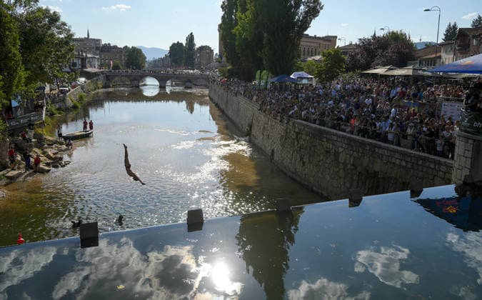 Bentbasa Cliff Diving 2026 in Sarajevo SARAJEVO, BOSNIA AND HERZEGOVINA - AUGUST 9: People jump during the 12th edition of the international Bentbasa Cliff Diving 2026 competition, which is held at Bentbasa, one of the most recognizable locations in Sarajevo, Bosnia and Herzegovina on August 9, 2026. Samir Jordamovic Anadolu Sarajevo Bosnia and Herzegovina. Editorial use only. Please get in touch for any other usage.  Copyright: x2026xAnadoluxSamirxJordamovicx