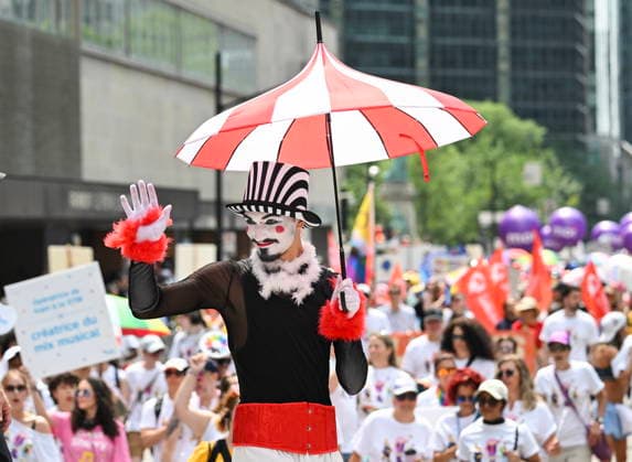August 9, 2026, Montreal, Pq, Canada: A participant waves to the crowd during the Pride parade in Montreal, on Sunday, Aug. 9, 2026. Montreal Canada  - ZUMAc35_ 20260809_zaf_c35_027 Copyright: xGrahamxHughesx