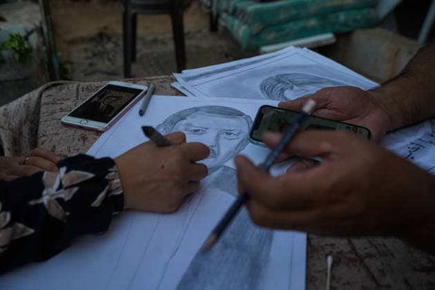 August 9, 2026, Gaza City, Palestine, State of: GAZA Gaza City, GAZA STRIP Ã¢â‚¬ AUGUST 9, 2026: Palestinian artist Nadia Abu Issa creates charcoal drawings depicting the hardships experienced by civilians during the war in Gaza, including shortages of food and water and life under continued displacement and insecurity. Living near an area affected by ongoing military activity, Abu Issa says her artwork aims to document the daily realities faced by Palestinians and preserve their experiences through art. Among her recent works is a portrait of Turkish President Recep Tayyip ErdoÄÅ¸an, which she says she created as a gesture of appreciation for TurkeyÃ¢â‚¬â ¢s support for Palestinians. Gaza City Palestine, State of  - ZUMAq101 20260809_zna_q101_140 Copyright: xRamzixAbuxAmerx