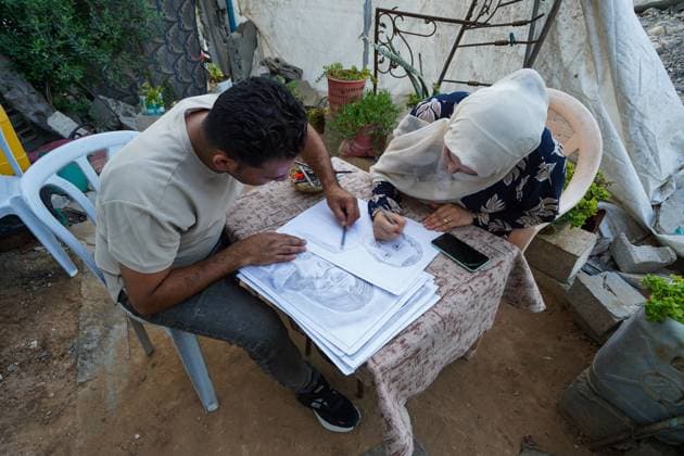 August 9, 2026, Gaza City, Palestine, State of: GAZA Gaza City, GAZA STRIP Ã¢â‚¬ AUGUST 9, 2026: Palestinian artist Nadia Abu Issa creates charcoal drawings depicting the hardships experienced by civilians during the war in Gaza, including shortages of food and water and life under continued displacement and insecurity. Living near an area affected by ongoing military activity, Abu Issa says her artwork aims to document the daily realities faced by Palestinians and preserve their experiences through art. Among her recent works is a portrait of Turkish President Recep Tayyip ErdoÄÅ¸an, which she says she created as a gesture of appreciation for TurkeyÃ¢â‚¬â ¢s support for Palestinians. Gaza City Palestine, State of  - ZUMAq101 20260809_zna_q101_143 Copyright: xRamzixAbuxAmerx