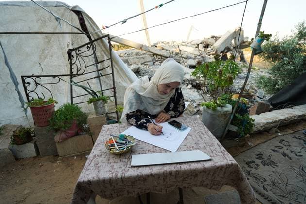 August 9, 2026, Gaza City, Palestine, State of: GAZA Gaza City, GAZA STRIP Ã¢â‚¬ AUGUST 9, 2026: Palestinian artist Nadia Abu Issa creates charcoal drawings depicting the hardships experienced by civilians during the war in Gaza, including shortages of food and water and life under continued displacement and insecurity. Living near an area affected by ongoing military activity, Abu Issa says her artwork aims to document the daily realities faced by Palestinians and preserve their experiences through art. Among her recent works is a portrait of Turkish President Recep Tayyip ErdoÄÅ¸an, which she says she created as a gesture of appreciation for TurkeyÃ¢â‚¬â ¢s support for Palestinians. Gaza City Palestine, State of  - ZUMAq101 20260809_zna_q101_148 Copyright: xRamzixAbuxAmerx