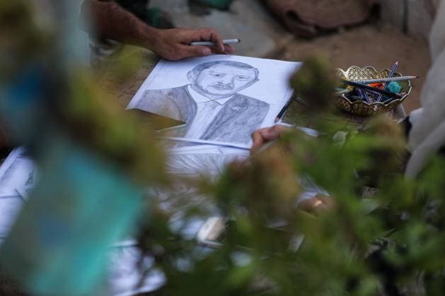 August 10, 2026, Gaza City, Palestine, State of: GAZA Gaza City, GAZA STRIP Ã¢â‚¬ AUGUST 9, 2026: Palestinian artist Nadia Abu Issa creates charcoal drawings depicting the hardships experienced by civilians during the war in Gaza, including shortages of food and water and life under continued displacement and insecurity. Living near an area affected by ongoing military activity, Abu Issa says her artwork aims to document the daily realities faced by Palestinians and preserve their experiences through art. Among her recent works is a portrait of Turkish President Recep Tayyip ErdoÄÅ¸an, which she says she created as a gesture of appreciation for TurkeyÃ¢â‚¬â ¢s support for Palestinians. Gaza City Palestine, State of  - ZUMAq101 20260810_zna_q101_008 Copyright: xRamzixAbuxAmerx