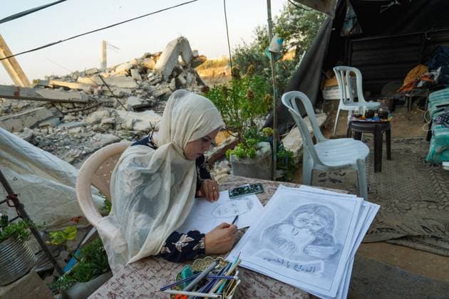 August 9, 2026, Gaza City, Palestine, State of: GAZA Gaza City, GAZA STRIP Ã¢â‚¬ AUGUST 9, 2026: Palestinian artist Nadia Abu Issa creates charcoal drawings depicting the hardships experienced by civilians during the war in Gaza, including shortages of food and water and life under continued displacement and insecurity. Living near an area affected by ongoing military activity, Abu Issa says her artwork aims to document the daily realities faced by Palestinians and preserve their experiences through art. Among her recent works is a portrait of Turkish President Recep Tayyip ErdoÄÅ¸an, which she says she created as a gesture of appreciation for TurkeyÃ¢â‚¬â ¢s support for Palestinians. Gaza City Palestine, State of - ZUMAq101 20260809_zna_q101_136 Copyright: xRamzixAbuxAmerx