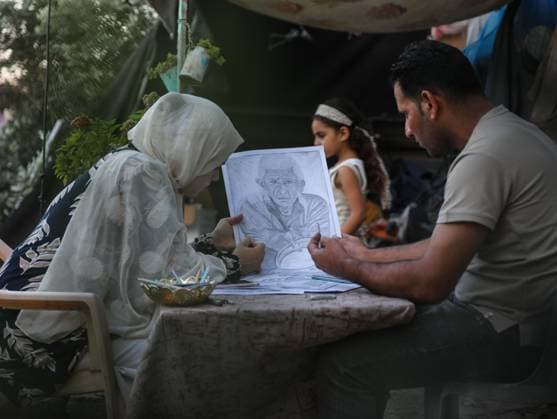 August 10, 2026, Gaza City, Palestine, State of: GAZA Gaza City, GAZA STRIP Ã¢â‚¬ AUGUST 9, 2026: Palestinian artist Nadia Abu Issa creates charcoal drawings depicting the hardships experienced by civilians during the war in Gaza, including shortages of food and water and life under continued displacement and insecurity. Living near an area affected by ongoing military activity, Abu Issa says her artwork aims to document the daily realities faced by Palestinians and preserve their experiences through art. Among her recent works is a portrait of Turkish President Recep Tayyip ErdoÄÅ¸an, which she says she created as a gesture of appreciation for TurkeyÃ¢â‚¬â ¢s support for Palestinians. Gaza City Palestine, State of - ZUMAq101 20260810_zna_q101_003 Copyright: xRamzixAbuxAmerx