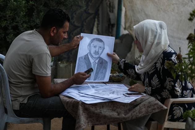 August 10, 2026, Gaza City, Palestine, State of: GAZA Gaza City, GAZA STRIP Ã¢â‚¬ AUGUST 9, 2026: Palestinian artist Nadia Abu Issa creates charcoal drawings depicting the hardships experienced by civilians during the war in Gaza, including shortages of food and water and life under continued displacement and insecurity. Living near an area affected by ongoing military activity, Abu Issa says her artwork aims to document the daily realities faced by Palestinians and preserve their experiences through art. Among her recent works is a portrait of Turkish President Recep Tayyip ErdoÄÅ¸an, which she says she created as a gesture of appreciation for TurkeyÃ¢â‚¬â ¢s support for Palestinians. Gaza City Palestine, State of - ZUMAq101 20260810_zna_q101_005 Copyright: xRamzixAbuxAmerx