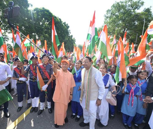 LUCKNOW, INDIA - AUGUST 9: Uttar Pradesh Chief Minister Yogi Adityanath and BJP state President Pankaj Chaudhary wave national flag during Tiranga Yatra under the Har Ghar Tiranga campaign ahead of the 80th Independence Day on August 9, 2026 in Lucknow, India. (Photo by Deepak Gupta Hindustan Times) UP CM Yogi Adityanath Leads Tiranga Yatra Under Har Ghar Tiranga Campaign Ahead Independence Day