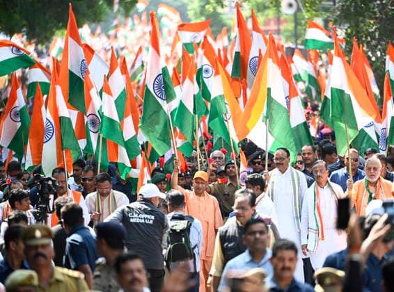 LUCKNOW, INDIA - AUGUST 9: Uttar Pradesh Chief Minister Yogi Adityanath along with deputy CM Keshav Prasad Maurya and deputy CM Brajesh Pathak and BJP state President Pankaj Chaudhary waves national flag during Tiranga Yatra under the Har Ghar Tiranga campaign ahead of the 80th Independence Day on August 9, 2026 in Lucknow, India. (Photo by Deepak Gupta Hindustan Times) UP CM Yogi Adityanath Leads Tiranga Yatra Under Har Ghar Tiranga Campaign Ahead Independence Day