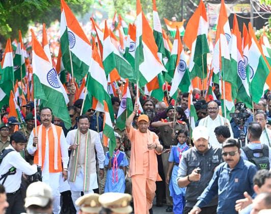 LUCKNOW, INDIA - AUGUST 9: Uttar Pradesh Chief Minister Yogi Adityanath along with deputy CM Keshav Prasad Maurya and deputy CM Brajesh Pathak and BJP state President Pankaj Chaudhary waves national flag during Tiranga Yatra under the Har Ghar Tiranga campaign ahead of the 80th Independence Day on August 9, 2026 in Lucknow, India. (Photo by Deepak Gupta Hindustan Times) UP CM Yogi Adityanath Leads Tiranga Yatra Under Har Ghar Tiranga Campaign Ahead Independence Day