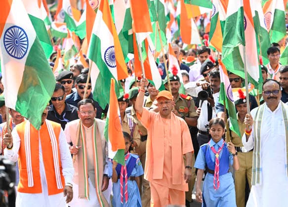 LUCKNOW, INDIA - AUGUST 9: Uttar Pradesh Chief Minister Yogi Adityanath along with deputy CM Keshav Prasad Maurya and deputy CM Brajesh Pathak and BJP state President Pankaj Chaudhary waves national flag during Tiranga Yatra under the Har Ghar Tiranga campaign ahead of the 80th Independence Day on August 9, 2026 in Lucknow, India. (Photo by Deepak Gupta Hindustan Times) UP CM Yogi Adityanath Leads Tiranga Yatra Under Har Ghar Tiranga Campaign Ahead Independence Day