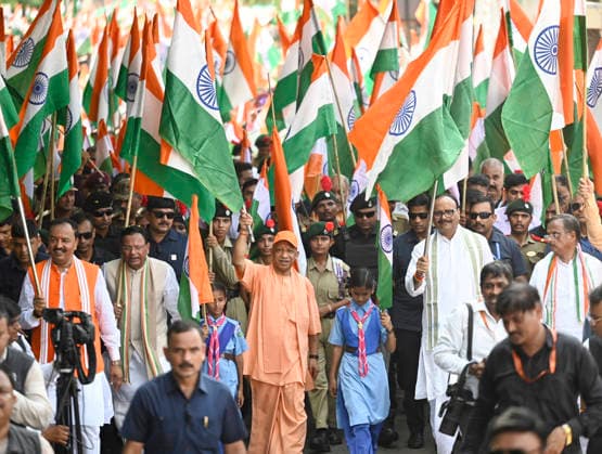 LUCKNOW, INDIA - AUGUST 9: Uttar Pradesh Chief Minister Yogi Adityanath along with deputy CM Keshav Prasad Maurya and deputy CM Brajesh Pathak and BJP state President Pankaj Chaudhary waves national flag during Tiranga Yatra under the Har Ghar Tiranga campaign ahead of the 80th Independence Day on August 9, 2026 in Lucknow, India. (Photo by Deepak Gupta Hindustan Times) UP CM Yogi Adityanath Leads Tiranga Yatra Under Har Ghar Tiranga Campaign Ahead Independence Day