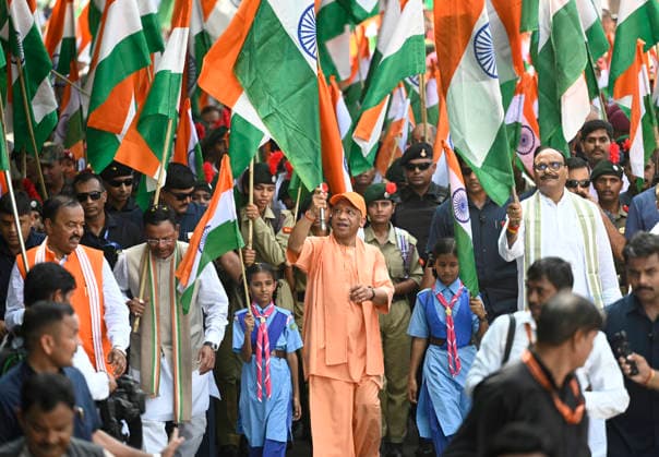 LUCKNOW, INDIA - AUGUST 9: Uttar Pradesh Chief Minister Yogi Adityanath along with deputy CM Keshav Prasad Maurya and deputy CM Brajesh Pathak and BJP state President Pankaj Chaudhary waves national flag during Tiranga Yatra under the Har Ghar Tiranga campaign ahead of the 80th Independence Day on August 9, 2026 in Lucknow, India. (Photo by Deepak Gupta Hindustan Times) UP CM Yogi Adityanath Leads Tiranga Yatra Under Har Ghar Tiranga Campaign Ahead Independence Day