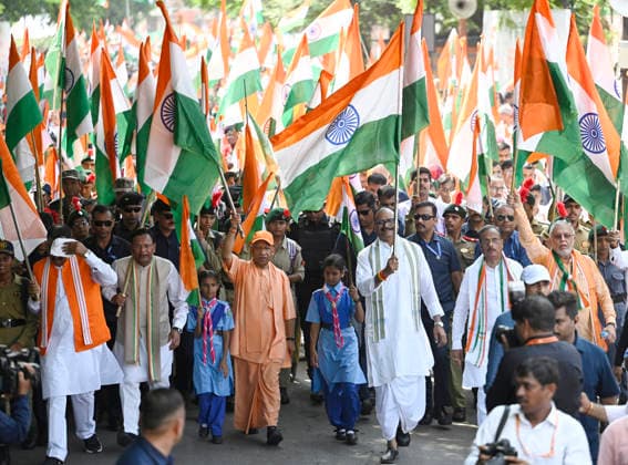 LUCKNOW, INDIA - AUGUST 9: Uttar Pradesh Chief Minister Yogi Adityanath along with deputy CM Keshav Prasad Maurya and deputy CM Brajesh Pathak and BJP state President Pankaj Chaudhary waves national flag during Tiranga Yatra under the Har Ghar Tiranga campaign ahead of the 80th Independence Day on August 9, 2026 in Lucknow, India. (Photo by Deepak Gupta Hindustan Times) UP CM Yogi Adityanath Leads Tiranga Yatra Under Har Ghar Tiranga Campaign Ahead Independence Day