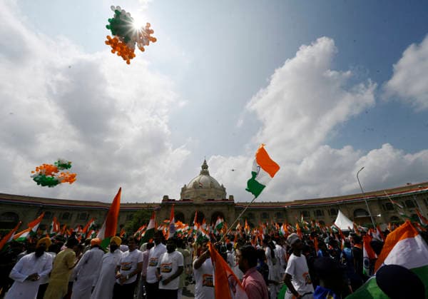 LUCKNOW, INDIA - AUGUST 9: People wave national flag during Tiranga Yatra under the Har Ghar Tiranga campaign ahead of the 80th Independence Day on August 9, 2026 in Lucknow, India. (Photo by Deepak Gupta Hindustan Times) UP CM Yogi Adityanath Leads Tiranga Yatra Under Har Ghar Tiranga Campaign Ahead Independence Day