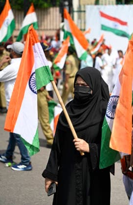 LUCKNOW, INDIA - AUGUST 9: A Muslim lady wave National flag during Tiranga Yatra under the Har Ghar Tiranga campaign ahead of the 80th Independence Day on August 9, 2026 in Lucknow, India. (Photo by Deepak Gupta Hindustan Times) UP CM Yogi Adityanath Leads Tiranga Yatra Under Har Ghar Tiranga Campaign Ahead Independence Day