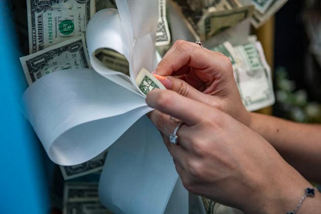 August 9, 2026, Boston, Massachusetts, USA: People pin money to the image of the saint is returned to its home during the Feast of the Madonna Della Cava in the North End of Boston, Massachusetts on August 9, 2026. Boston USA - ZUMAp158 20260809_aap_p158_003 Copyright: xJosephxPreziosox