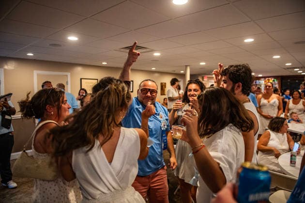 August 9, 2026, Boston, Massachusetts, USA: Patrons dance inside the FishermanÃ¢â‚¬â ¢s club during the Feast of the Madonna Della Cava in the North End of Boston, Massachusetts on August 9, 2026. Boston USA  - ZUMAp158 20260809_aap_p158_025 Copyright: xJosephxPreziosox