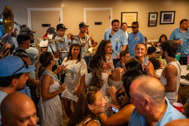 August 9, 2026, Boston, Massachusetts, USA: Patrons dance inside the FishermanÃ¢â‚¬â ¢s club during the Feast of the Madonna Della Cava in the North End of Boston, Massachusetts on August 9, 2026. Boston USA - ZUMAp158 20260809_aap_p158_015 Copyright: xJosephxPreziosox