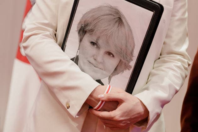 August 9, 2026, Warsaw, Poland: A portrait of TUT.BY CEO Liudmila Chekina is seen on a folder held by Belarusian democratic leader Sviatlana Tsikhanouskaya during the second day of the New Belarus Conference. The second day of the New Belarus Conference brought together representatives of Belarusian democratic forces, activists, former political prisoners, civil society representatives and international partners. The programme focused on discussions about Belarus, support for Belarusians, regional developments and the role of democratic forces in shaping the country™s future. Warsaw Poland  - ZUMAs197 20260809_aaa_s197_042 Copyright: xVolhaxShukailax