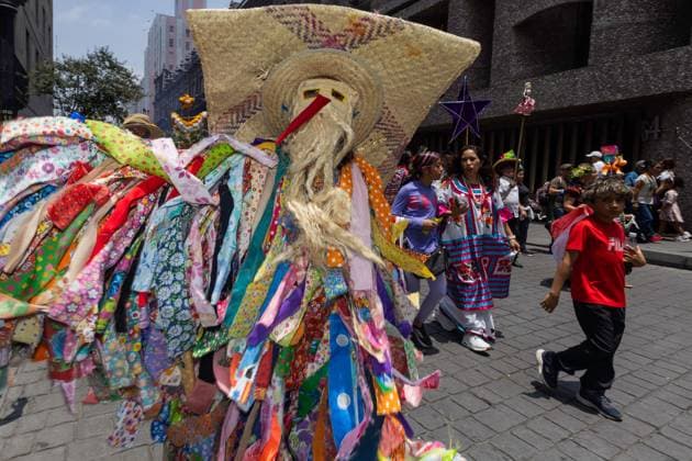 August 9, 2026, Mexico City, Mexico: MEXICO Mexico City, MEXICO Ã¢â‚¬ AUGUST 9, 2026: Participants wearing traditional clothing dance and march during the 17th Mega Calenda cultural parade from the Angel of Independence to the Zocalo in Mexico City, August 9, 2026. Organized by the Mexico City government, the event commemorates the International Day of the World s Indigenous Peoples and is part of the 12th Festival of Indigenous Cultures, Indigenous Peoples, and Native Neighborhoods of Mexico City. Mexico City Mexico - ZUMAq101 20260809_zna_q101_166 Copyright: xCristianxLeyvax