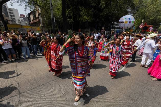 August 9, 2026, Mexico City, Mexico: MEXICO Mexico City, MEXICO Ã¢â‚¬ AUGUST 9, 2026: Participants wearing traditional clothing dance and march during the 17th Mega Calenda cultural parade from the Angel of Independence to the Zocalo in Mexico City, August 9, 2026. Organized by the Mexico City government, the event commemorates the International Day of the World s Indigenous Peoples and is part of the 12th Festival of Indigenous Cultures, Indigenous Peoples, and Native Neighborhoods of Mexico City. Mexico City Mexico - ZUMAq101 20260809_zna_q101_170 Copyright: xCristianxLeyvax