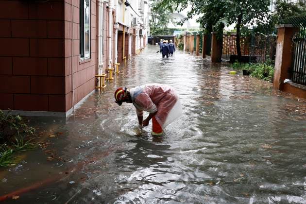 SHANGHAI, CHINA - AUGUST 09: Firefighters conduct drainage operations in a residential area on August 9, 2026 in Shanghai, China. The Shanghai Meteorological Observatory upgraded the rainstorm warning signal for the central urban area from orange to red at 10:30 a.m. due to the impact of Typhoon Dolphin.  Copyright: xChinaxNewsxServicex 111658975268