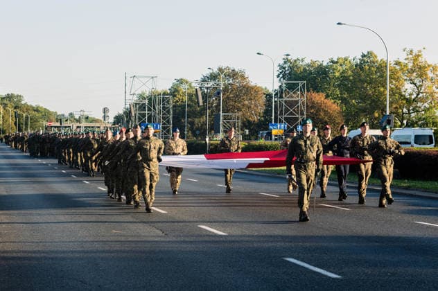 August 9, 2026, Warsaw, Mazovia, Poland: The parade rehearsal begins, led by the flag of the Republic of Poland. Early in the morning of 9th August, Poland s armed forces, and those of allies stationed in the country, take part in a rehearsal in preparation for a parade on National Armed Forces Day on the 15th August. Soldiers muster as the sun rises over the Vistula River and march past grandstands prepared for dignitaries. The soldiers were followed by mechanised divisions travelling in tanks and a variety of armoured vehicles. Afterwards, Secretary of State in the Ministry of Defence, Pawel Bejda addresses a post-rehearsal press conference, where he is accompanied by the Chief of the General Staff of the Polish Armed Forces, General Wies - ZUMAs197 20260809_aaa_s197_068 Copyright: xNeilxMiltonx