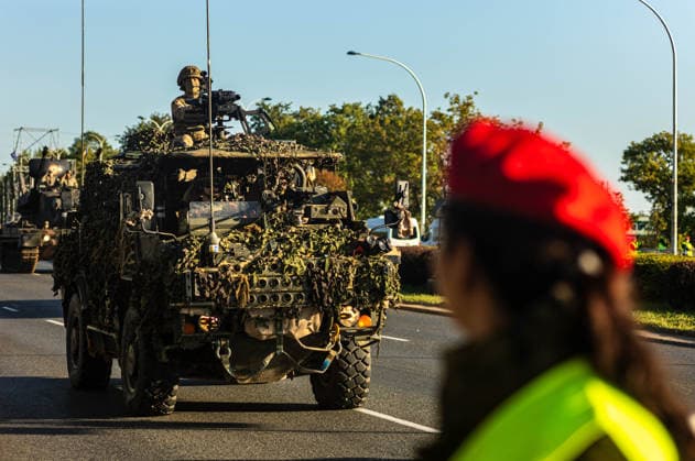 August 9, 2026, Warsaw, Mazovia, Poland: An armoured vehicle passes during the parade rehearsal as a member of the Polish Military Police looks on. Early in the morning of 9th August, Poland s armed forces, and those of allies stationed in the country, take part in a rehearsal in preparation for a parade on National Armed Forces Day on the 15th August. Soldiers muster as the sun rises over the Vistula River and march past grandstands prepared for dignitaries. The soldiers were followed by mechanised divisions travelling in tanks and a variety of armoured vehicles. Afterwards, Secretary of State in the Ministry of Defence, Pawel Bejda addresses a post-rehearsal press conference, where he is accompanied by the Chief of the General Staff of th - ZUMAs197 20260809_aaa_s197_083 Copyright: xNeilxMiltonx
