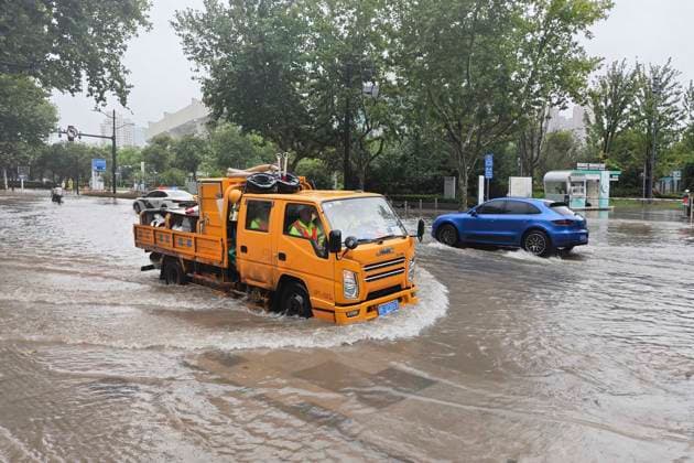 SHANGHAI, CHINA - AUGUST 09: A drainage emergency vehicle rushes to a waterlogged spot to carry out pumping operations as Typhoon Dolphin brings heavy rainfall on August 9, 2026 in Shanghai, China.  Copyright: xVCGx 111659005869