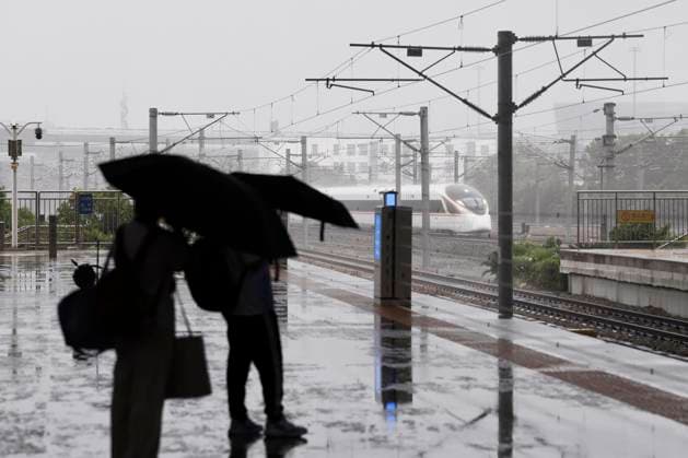SHANGHAI, CHINA - AUGUST 09: Passengers wait on the platform of Shanghai Hongqiao Railway Station for arriving high-speed trains amid heavy rain caused by Typhoon Dolphin on August 9, 2026 in Shanghai, China. China s national observatory on August 9 activated a red alert -- the highest level in the country s typhoon warning system -- as Typhoon Dolphin approaches.  Copyright: xChinaxNewsxServicex 111658973468