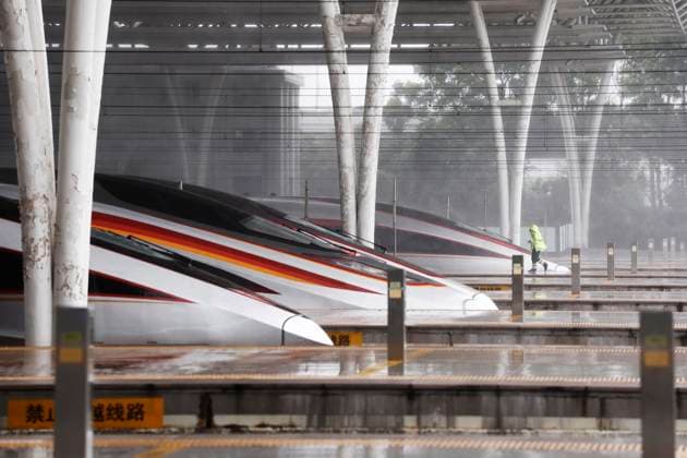 SHANGHAI, CHINA - AUGUST 09: Staff members stand on the platform of Shanghai Hongqiao Railway Station in the rain as Typhoon Dolphin approaches on August 9, 2026 in Shanghai, China. China s national observatory on August 9 activated a red alert -- the highest level in the country s typhoon warning system -- as Typhoon Dolphin approaches.  Copyright: xChinaxNewsxServicex 111658973323