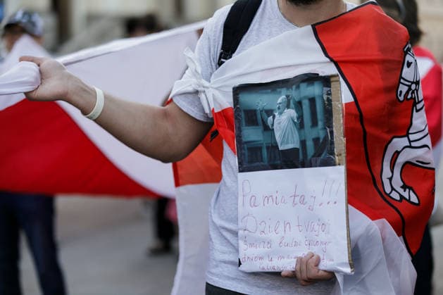 August 9, 2026, Warsaw, Poland: A man holds a placard during an evening rally marking the sixth anniversary of the August 2020 presidential election in Belarus. An evening gathering marking the sixth anniversary of the August 2020 presidential election in Belarus was held near the Nicolaus Copernicus Monument in central Warsaw, bringing together leaders of Belarusian democratic forces, public figures and activists, as well as several hundred participants. Warsaw Poland - ZUMAs197 20260809_aaa_s197_103 Copyright: xVolhaxShukailax