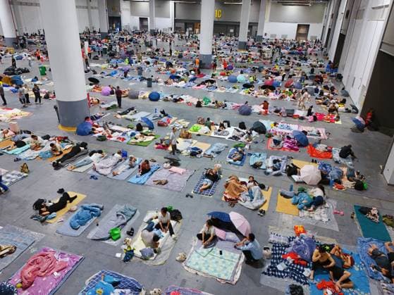 HANGZHOU, CHINA - AUGUST 09: A temporary shelter is set up for workers at Qianjiang Century City on August 9, 2026 in Hangzhou, Zhejiang Province of China. Nearly 10,000 workers were safely evacuated from the area as Typhoon Dolphin approaches.  Copyright: xVCGx 111658990986