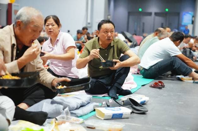 HANGZHOU, CHINA - AUGUST 09: A temporary shelter is set up for workers at Qianjiang Century City on August 9, 2026 in Hangzhou, Zhejiang Province of China. Nearly 10,000 workers were safely evacuated from the area as Typhoon Dolphin approaches.  Copyright: xVCGx 111658991045