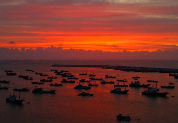 LIANYUNGANG, CHINA - AUGUST 09: Colorful sunset clouds appear over Liandao Island on August 9, 2026 in Lianyungang, Jiangsu Province of China. The weather phenomenon occurred as Typhoon Dolphin approached the region.  Copyright: xVCGx 111659074170