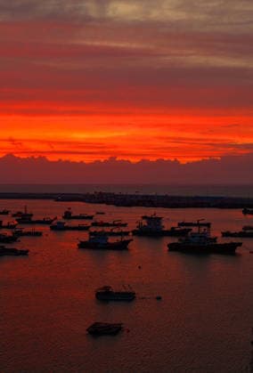 LIANYUNGANG, CHINA - AUGUST 09: Colorful sunset clouds appear over Liandao on August 9, 2026 in Lianyungang, Jiangsu Province of China. The weather phenomenon was influenced by Typhoon Dolphin.  Copyright: xVCGx 111659074171