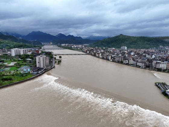 YUEQING, CHINA - AUGUST 10: Floodwaters flow in a creek after Typhoon Dolphin passed through on August 10, 2026 in Yueqing, Zhejiang Province of China. Recovery efforts are underway following the typhoon.  Copyright: xVCGx 111659089568