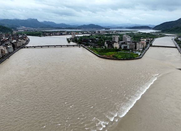 YUEQING, CHINA - AUGUST 10: Floodwaters flow through a creek on August 10, 2026 in Yueqing, Zhejiang Province of China. The area is undergoing post-disaster recovery efforts following Typhoon Dolphin .  Copyright: xVCGx 111659089570