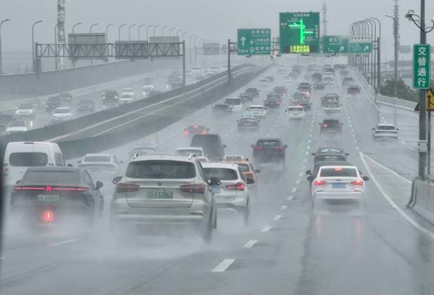 SHANGHAI, CHINA - AUGUST 10: Vehicles are congested on elevated roads due to Typhoon Dolphin on August 10, 2026 in Shanghai, China. Typhoon Dolphin brought heavy rain and strong winds to the city, causing traffic disruptions.  Copyright: xVCGx 111659110575