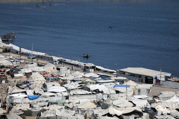 Displacement tents crowd Gaza City coast amid widespread destruction A general view shows tents sheltering displaced Palestinians crowded along the coast of Gaza City and among buildings damaged during the war, on August 10, 2026. Families have sought refuge in makeshift shelters after their homes were destroyed, amid difficult living and humanitarian conditions. Photo by Bilal Osama apaimages Gaza city Gaza Strip Palestinian Territory 100826_Gaza_BO_00(43) Copyright: xapaimagesxBilalxOsamax xapaimagesx