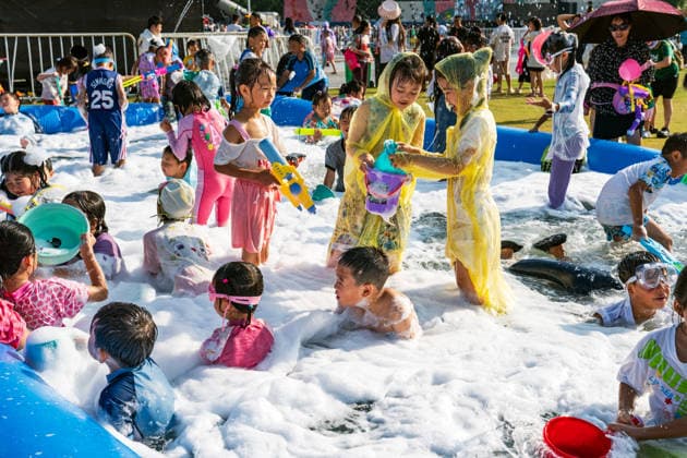 GUIYANG, CHINA - AUGUST 09: Citizens and tourists splash water on each other during the Summer Wonderland Ethnic Group Celebration at Guanshanhu Park on August 9, 2026 in Guiyang, Guizhou Province of China. The event features water splashing activities allowing participants to cool off during the summer heat.  Copyright: xVCGx 111659117651