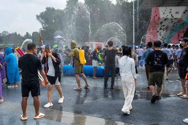 GUIYANG, CHINA - AUGUST 09: Citizens and tourists splash water on each other during the Summer Wonderland Ethnic Group Celebration at Guanshanhu Park on August 9, 2026 in Guiyang, Guizhou Province of China. The event features water splashing activities allowing participants to cool off during the summer heat.  Copyright: xVCGx 111659117636